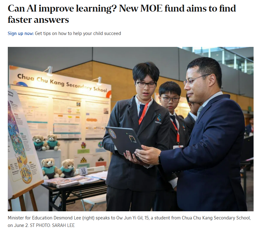 Students presenting their project to the Minister for Education.